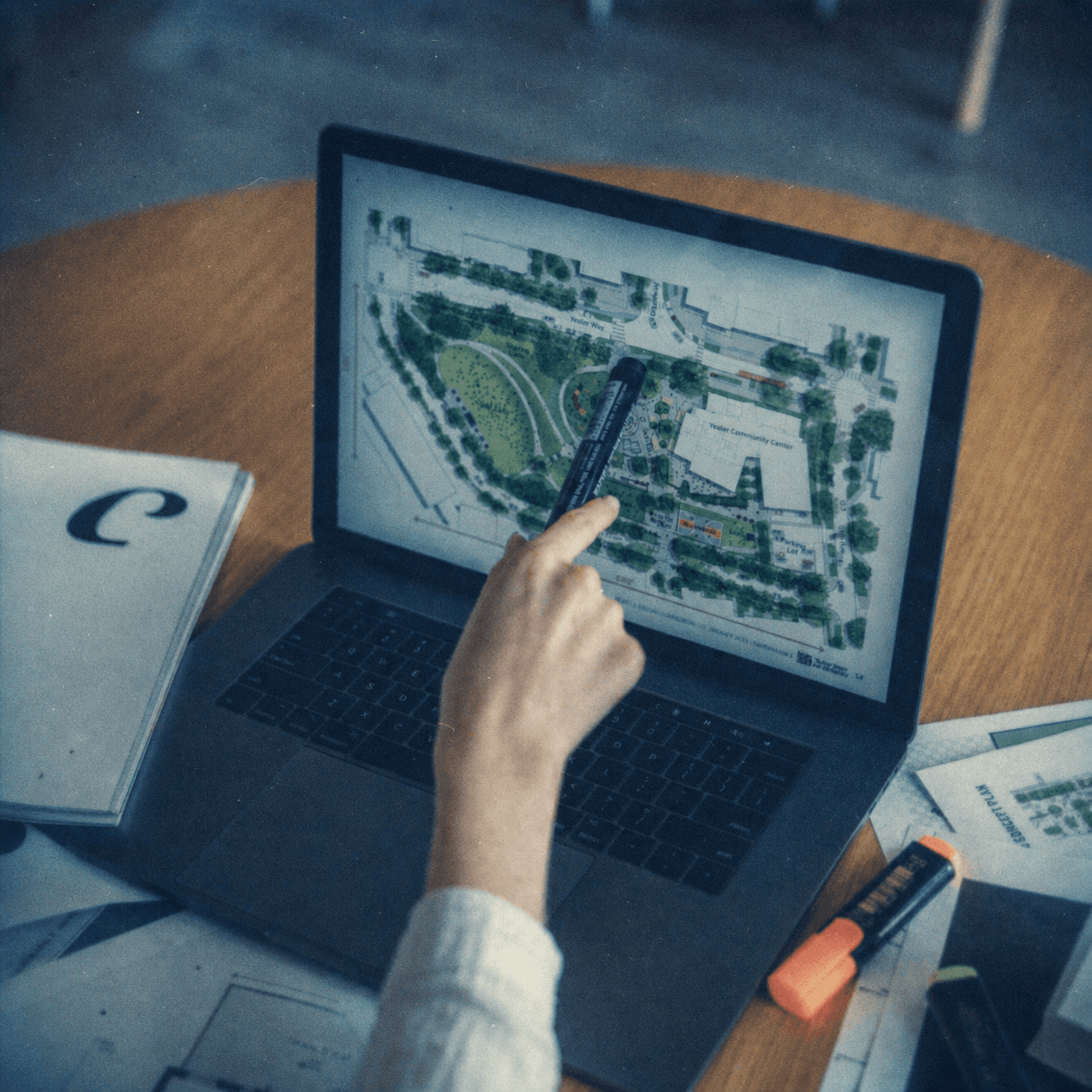 Person reviewing an urban map on a laptop