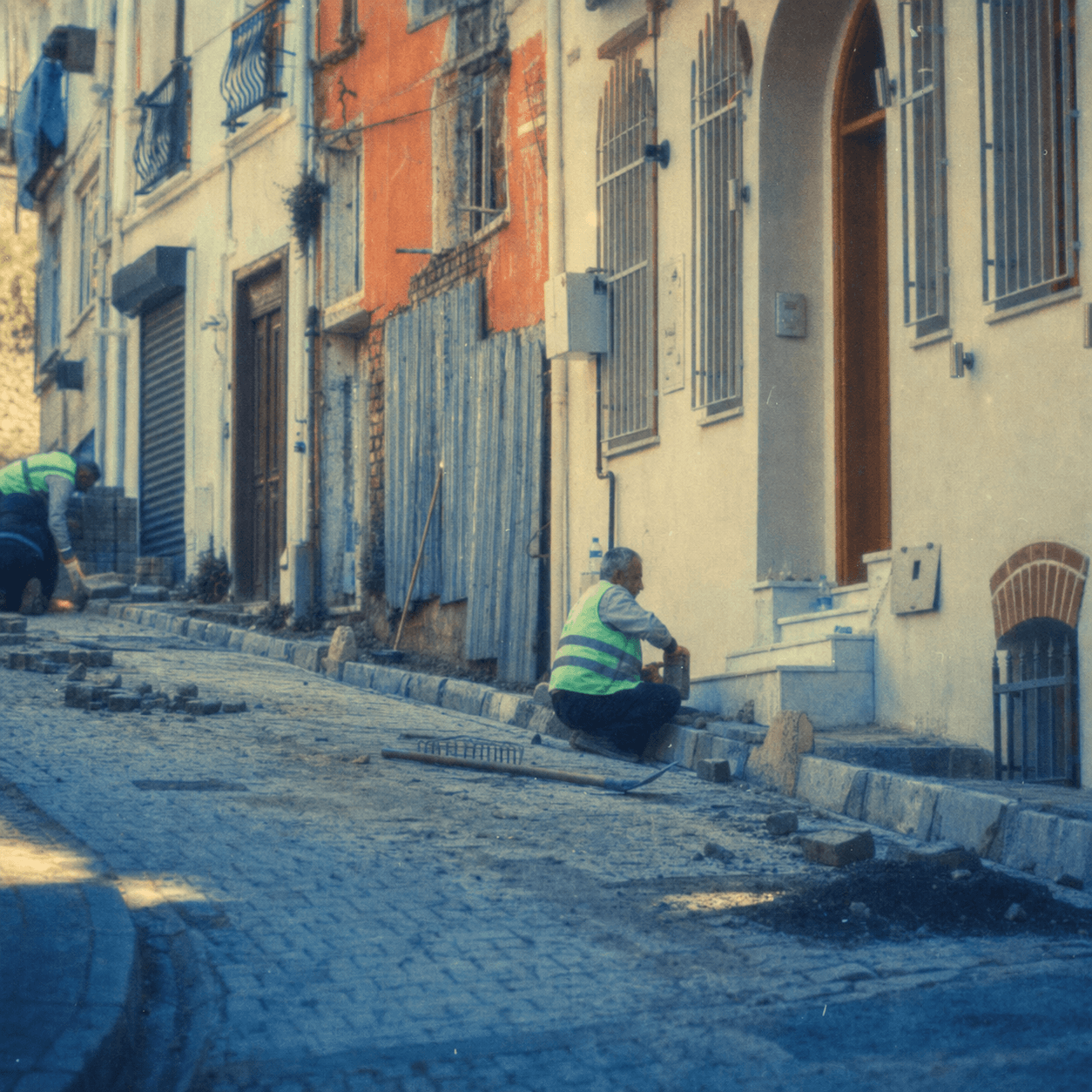 Workers repairing an urban street