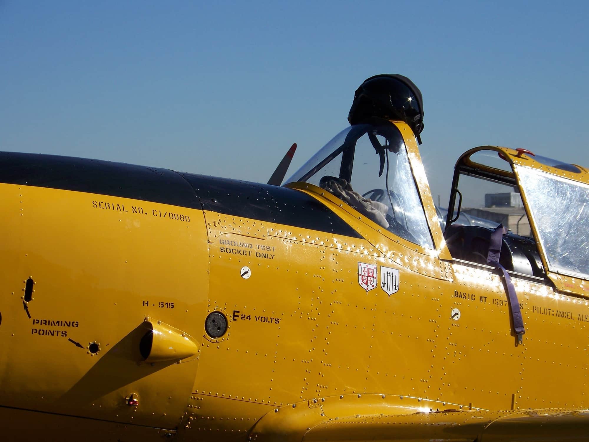 A yellow aeroplane prepared for takeoff